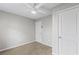 Bedroom with ceiling fan, carpeted floors and two white doors at 2409 Swallow Se Cir, Atlanta, GA 30315
