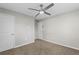 Bright bedroom with ceiling fan, neutral walls, and carpet flooring at 2409 Swallow Se Cir, Atlanta, GA 30315