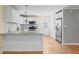 Modern kitchen with stainless steel appliances, granite countertops and subway tile backsplash at 2409 Swallow Se Cir, Atlanta, GA 30315