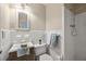 Traditional bathroom featuring all white tile, standard shower and single sink vanity at 6550 Bridgewood Valley Rd, Atlanta, GA 30328