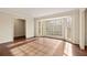 Bright living room with hardwood floors and a bay window providing plenty of natural light at 6550 Bridgewood Valley Rd, Atlanta, GA 30328