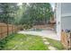 Private backyard featuring a fenced in pool, lush landscaping, and stone patio at 1901 Shelburne Cv, Marietta, GA 30068