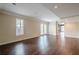 Spacious basement area with wood floors, neutral walls, and walkout doors leading to the outdoors at 1901 Shelburne Cv, Marietta, GA 30068