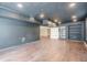 Basement featuring a modern color palette, recessed lighting, and wood flooring, perfect for entertaining at 1901 Shelburne Cv, Marietta, GA 30068