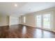 Spacious finished basement featuring wood-look flooring, closet, and walk-out doors at 1901 Shelburne Cv, Marietta, GA 30068
