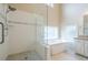 Modern bathroom featuring a glass shower, soaking tub, and tile accents at 1901 Shelburne Cv, Marietta, GA 30068