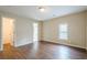 Bright bedroom featuring wood floors and a window for natural light at 1901 Shelburne Cv, Marietta, GA 30068