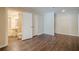 Spacious bedroom with wood floors, neutral walls, and attached bathroom, offering comfort and convenience at 1901 Shelburne Cv, Marietta, GA 30068