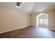 A spacious bedroom with hardwood floors and a skylight illuminates the space at 1901 Shelburne Cv, Marietta, GA 30068