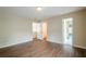 Bright bedroom with wood floors and multiple doorways for easy access at 1901 Shelburne Cv, Marietta, GA 30068