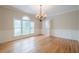 Traditional dining room with hardwood floors and large window at 1901 Shelburne Cv, Marietta, GA 30068