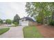 Lovely home with a three-car garage and lush green lawn on a well-maintained street in a suburban neighborhood at 1901 Shelburne Cv, Marietta, GA 30068