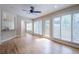 Bright room with hardwood floors and access to the deck, seamlessly connecting indoor and outdoor living spaces at 1901 Shelburne Cv, Marietta, GA 30068
