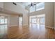 Bright and airy living room with large windows, hardwood floors and neutral walls that create a seamless flow at 1901 Shelburne Cv, Marietta, GA 30068