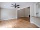 Bright living room boasts hardwood floors, neutral paint, and open access to other rooms at 1901 Shelburne Cv, Marietta, GA 30068
