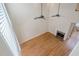 An open living room includes hardwood floors, a fireplace, and bright windows at 1901 Shelburne Cv, Marietta, GA 30068