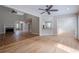 Open-concept living room with hardwood floors and views into the kitchen and dining area at 1901 Shelburne Cv, Marietta, GA 30068