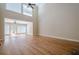 Expansive living room with soaring ceilings and hardwood floors, flooded with natural light from large windows at 1901 Shelburne Cv, Marietta, GA 30068