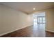 A neutrally decorated living area features hardwood floors and lots of light at 1901 Shelburne Cv, Marietta, GA 30068