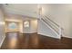 Spacious living room featuring dark hardwood floors and a high ceiling at 280 Concord Ter, Mcdonough, GA 30253