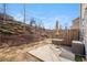 Patio in a backyard with a metal table set and an umbrella at 366 Cherryhill Ln, Woodstock, GA 30188