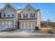 Charming two-story home with a brick and shingle facade and a two-car garage at 366 Cherryhill Ln, Woodstock, GA 30188