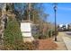 East Main neighborhood entrance sign, featuring brick pillars and professional landscaping at 366 Cherryhill Ln, Woodstock, GA 30188