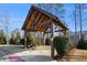 Covered wooden pavilion with a brown roof located in a community park at 366 Cherryhill Ln, Woodstock, GA 30188