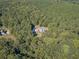 Single Gathering home surrounded by a wooded area at 946 Gaithers Rd, Mansfield, GA 30055