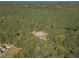 Aerial view of a home nestled in a wooded area, showcasing its private setting at 946 Gaithers Rd, Mansfield, GA 30055