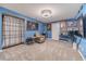 Finished basement recreation room with large screen TV and comfortable seating at 946 Gaithers Rd, Mansfield, GA 30055