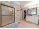 Large bathroom with walk-in shower and separate vanity at 946 Gaithers Rd, Mansfield, GA 30055