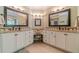 Bathroom with double vanity, granite countertops and large mirrors at 946 Gaithers Rd, Mansfield, GA 30055