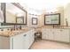 Elegant bathroom with granite countertops, double vanity and large mirrors at 946 Gaithers Rd, Mansfield, GA 30055