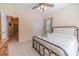 Comfortable bedroom with a metal bed frame and access to a hallway at 946 Gaithers Rd, Mansfield, GA 30055