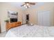 Charming bedroom with a metal bed frame, dresser, and large windows at 946 Gaithers Rd, Mansfield, GA 30055