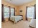 Small bedroom with a metal bed frame and plenty of natural light at 946 Gaithers Rd, Mansfield, GA 30055
