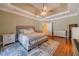 Main bedroom with hardwood floors, large bed and access to bathroom at 946 Gaithers Rd, Mansfield, GA 30055