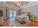 Bright bedroom with hardwood floors, large bed and private balcony access at 946 Gaithers Rd, Mansfield, GA 30055