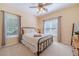 Cozy bedroom with a metal bed frame and ample natural light at 946 Gaithers Rd, Mansfield, GA 30055