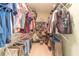 Walk-in closet with ample shelving and hanging space at 946 Gaithers Rd, Mansfield, GA 30055