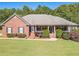 Brick house with a large front yard and mature trees at 946 Gaithers Rd, Mansfield, GA 30055