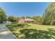 Brick house with a large front yard and long driveway at 946 Gaithers Rd, Mansfield, GA 30055