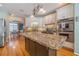 Modern kitchen with granite countertops, stainless steel appliances and an island at 946 Gaithers Rd, Mansfield, GA 30055