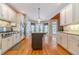 Spacious kitchen boasts granite countertops, stainless steel appliances, and an island at 946 Gaithers Rd, Mansfield, GA 30055