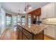 Eat-in kitchen with granite island, breakfast nook and views to the backyard at 946 Gaithers Rd, Mansfield, GA 30055
