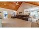 Living room with views into kitchen, vaulted ceiling and sectional sofa at 946 Gaithers Rd, Mansfield, GA 30055