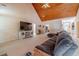 Living area with sectional sofa, high ceilings and views into other rooms at 946 Gaithers Rd, Mansfield, GA 30055