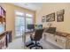 Home office with built-in desk and large window at 946 Gaithers Rd, Mansfield, GA 30055