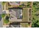Aerial view of a home with a landscaped backyard and mature trees on a sunny day at 231 Haney Rd, Woodstock, GA 30188